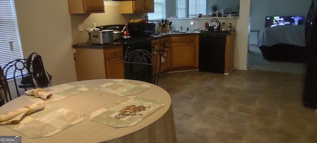 11950 Markham Way, Hampton, GA 30228 - kitchen featuring brown cabinetry and dark countertops