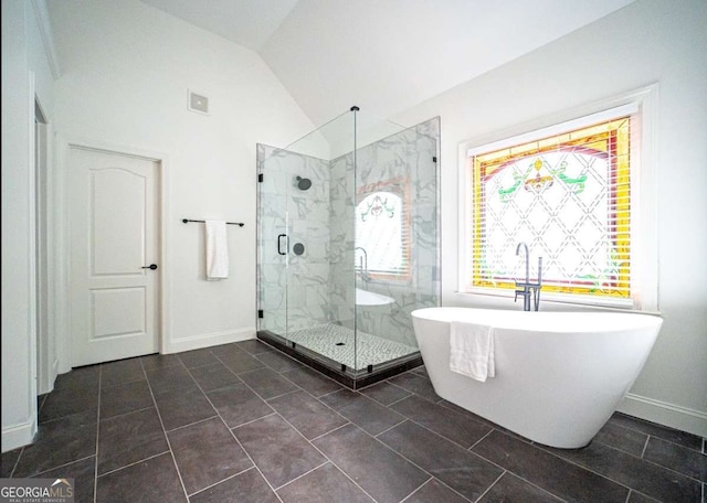 21 Whitegrass Way, Grayson, GA 30017 - bathroom with a marble finish shower, a soaking tub, lofted ceiling, and baseboards
