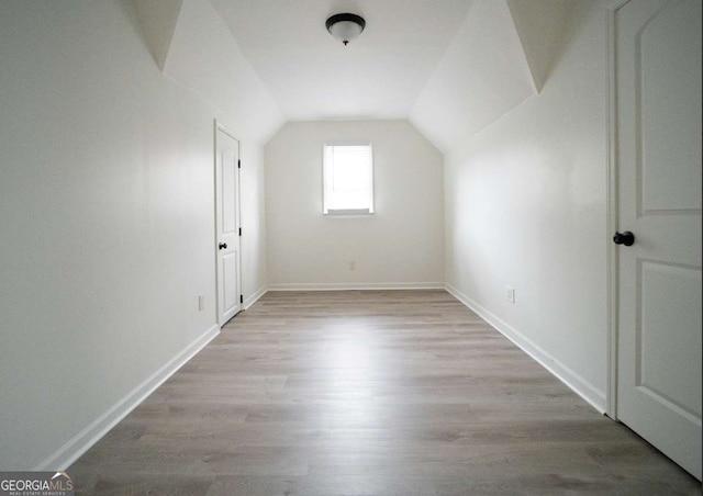 21 Whitegrass Way, Grayson, GA 30017 - bonus room featuring wood finished floors, vaulted ceiling, and baseboards