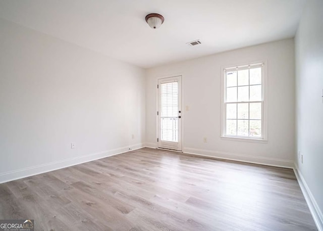 21 Whitegrass Way, Grayson, GA 30017 - unfurnished room with wood finished floors, plenty of natural light, and baseboards