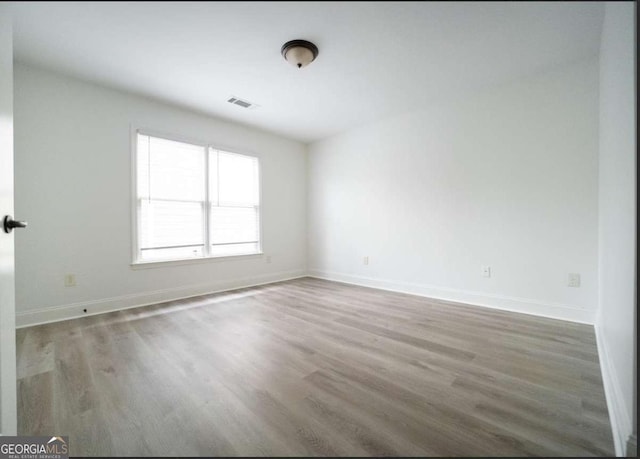 21 Whitegrass Way, Grayson, GA 30017 - unfurnished room with wood finished floors and baseboards