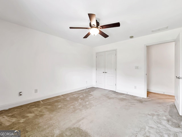 unfurnished bedroom featuring baseboards, carpet, a closet, and a ceiling fan