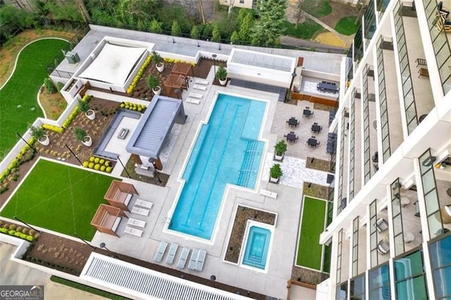 view from above of property with a pool area