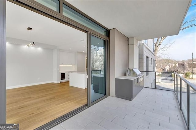 balcony featuring area for grilling