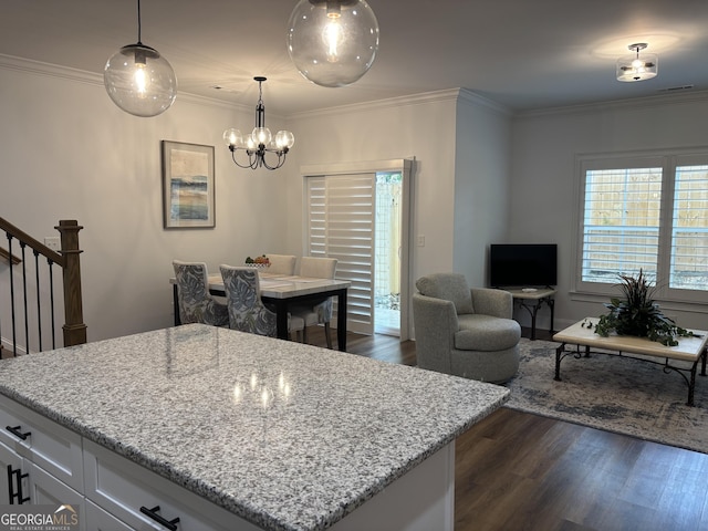 633 E 3rd St, Rome, GA 30161 - kitchen with dark wood-type flooring, a chandelier, white cabinets, light stone counters, and ornamental molding