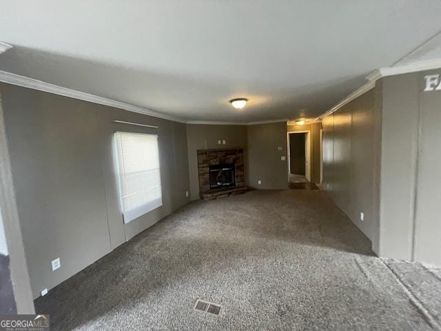 507 Jackson St, Montezuma, GA 31063 - unfurnished living room featuring ornamental molding, carpet floors, and a stone fireplace