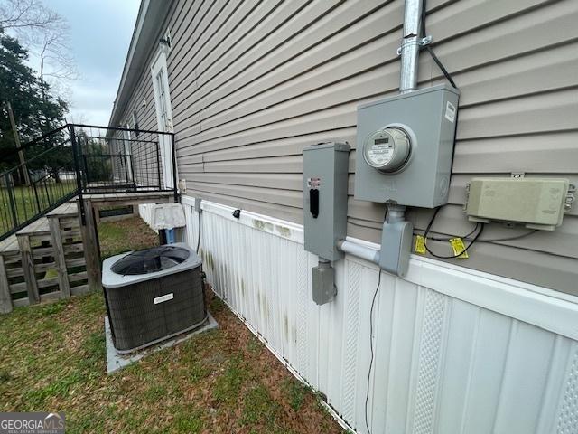 507 Jackson St, Montezuma, GA 31063 - exterior view of electric meter, central AC unit, and fence