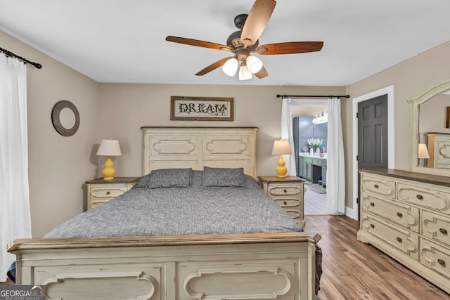 bedroom featuring wood finished floors and a ceiling fan
