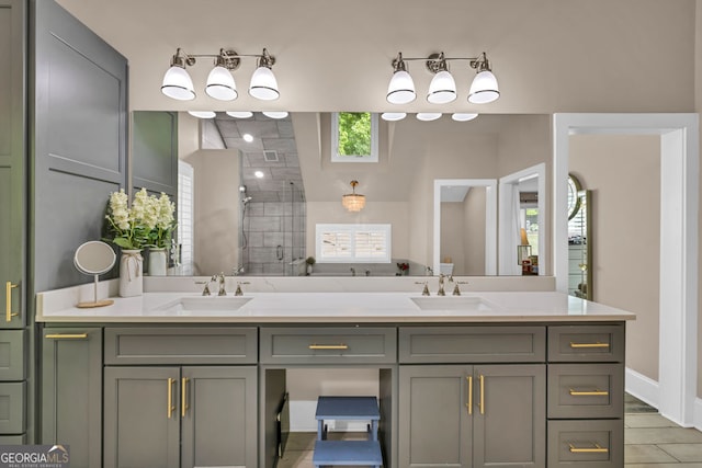 bathroom featuring a stall shower and double vanity