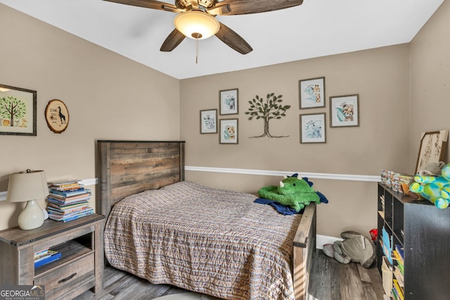 bedroom with wood finished floors, baseboards, and a ceiling fan