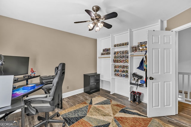 office featuring ceiling fan, wood finished floors, and built in features