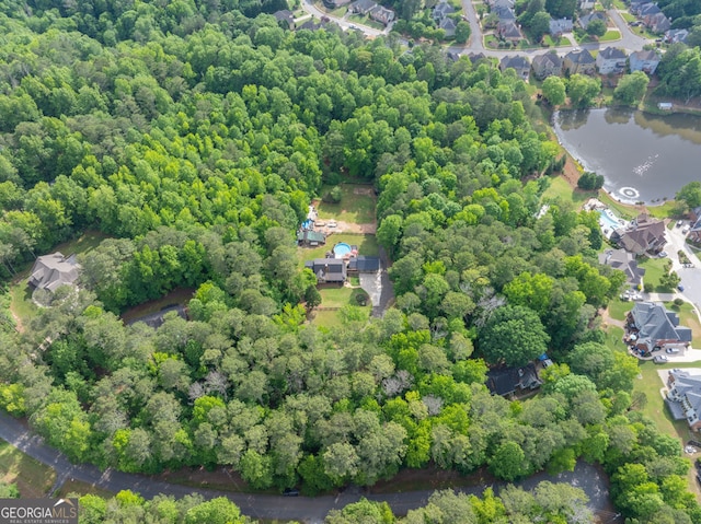 aerial view of property and surrounding area with a large body of water