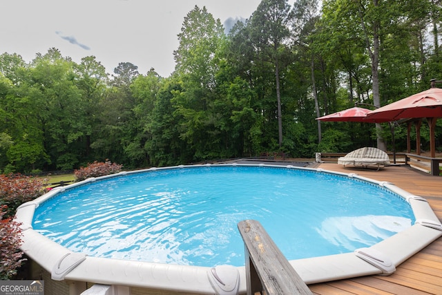 outdoor pool featuring a deck