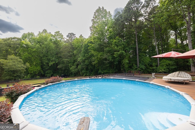 swimming pool featuring a wooden deck