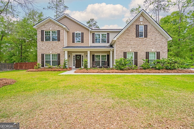 craftsman-style home featuring brick siding