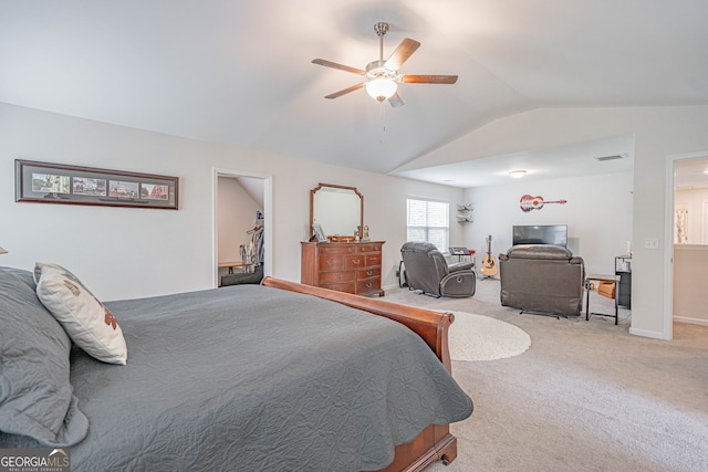 carpeted bedroom featuring lofted ceiling, a ceiling fan, and baseboards