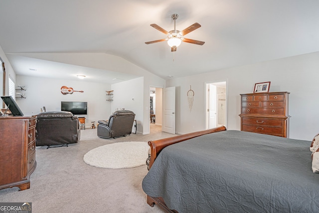 carpeted bedroom with vaulted ceiling and a ceiling fan
