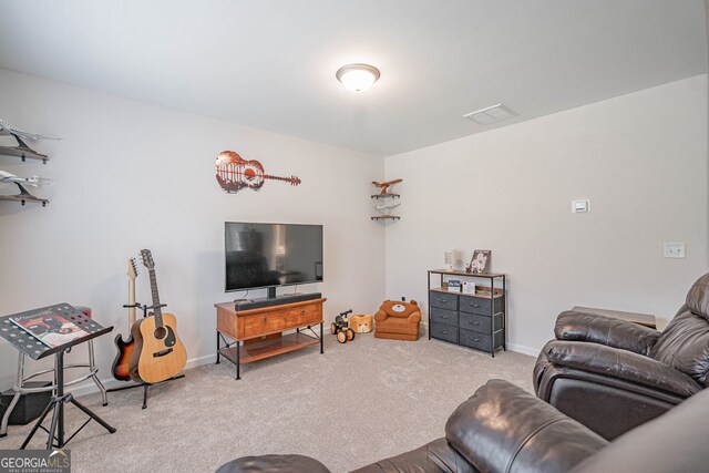 living area with carpet floors and baseboards