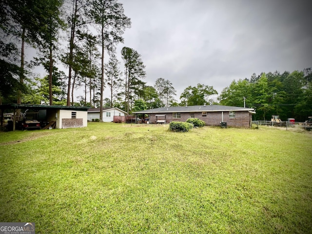 view of yard featuring a carport