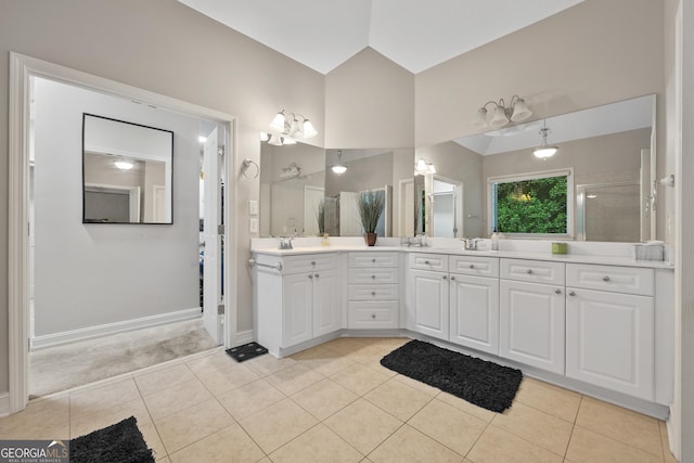 6217 Millstone Trl, Douglasville, GA 30135 - bathroom featuring double vanity, tile patterned floors, a shower with shower door, and baseboards