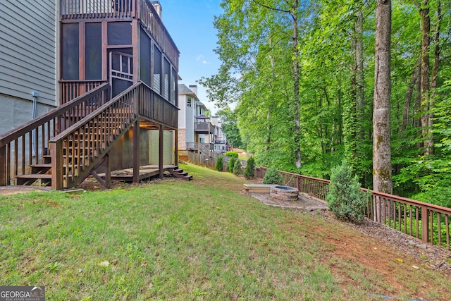 6217 Millstone Trl, Douglasville, GA 30135 - view of yard with stairway, a sunroom, a deck, and a fire pit