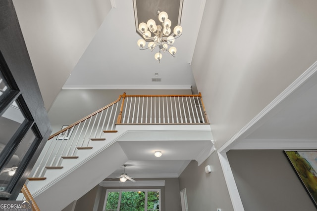 6217 Millstone Trl, Douglasville, GA 30135 - stairway featuring a high ceiling, ceiling fan, a chandelier, and ornamental molding