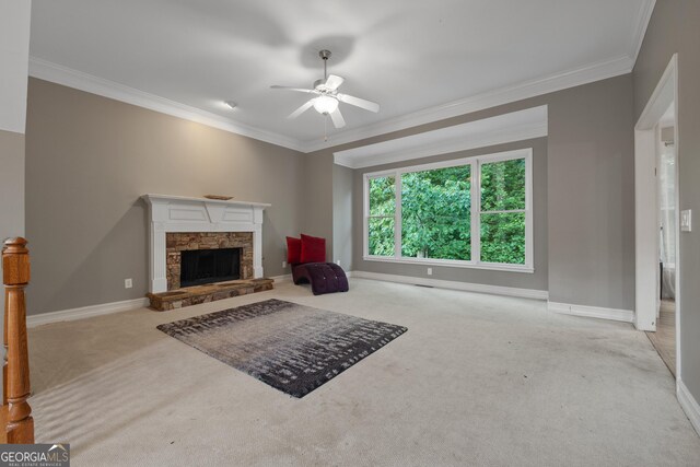 6217 Millstone Trl, Douglasville, GA 30135 - carpeted living area with ornamental molding, ceiling fan, a stone fireplace, and baseboards