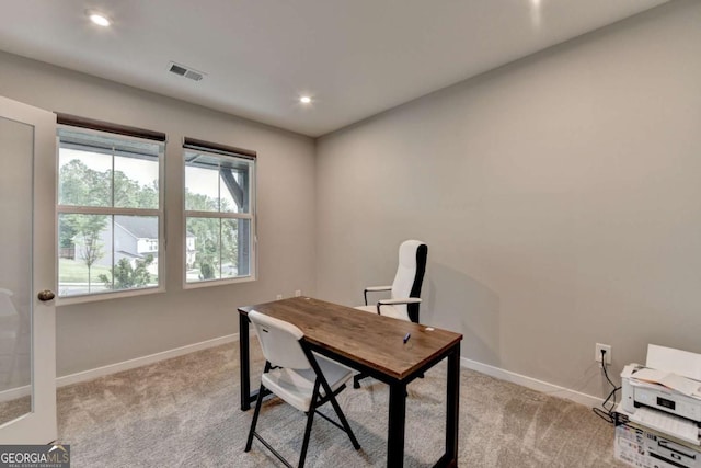 office space with baseboards, light carpet, and recessed lighting
