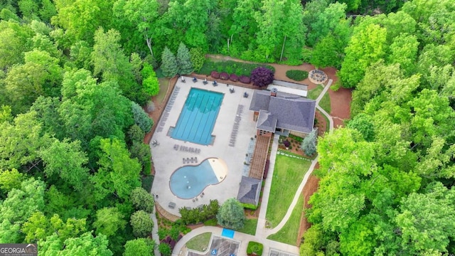 view of subject property featuring a pool area