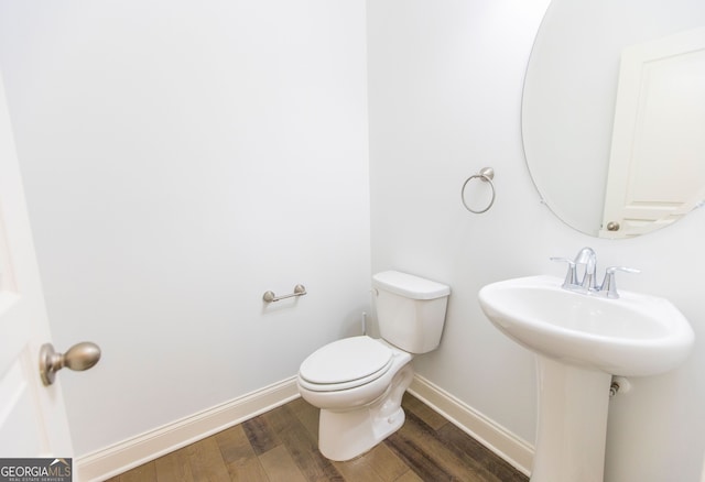 9872 Cameron Parc Cir, Johns Creek, GA 30022 - half bath featuring baseboards, wood finished floors, toilet, and a sink