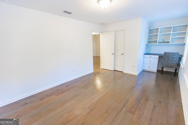 9872 Cameron Parc Cir, Johns Creek, GA 30022 - unfurnished bedroom featuring wood-type flooring and baseboards