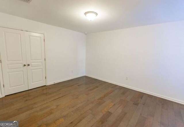 9872 Cameron Parc Cir, Johns Creek, GA 30022 - empty room with wood finished floors and baseboards