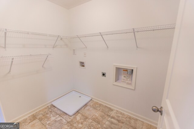 9872 Cameron Parc Cir, Johns Creek, GA 30022 - laundry area with hookup for an electric dryer, hookup for a washing machine, and baseboards