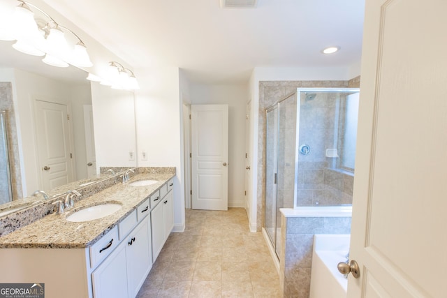 9872 Cameron Parc Cir, Johns Creek, GA 30022 - bathroom featuring a stall shower, double vanity, tile patterned floors, a bath, and baseboards
