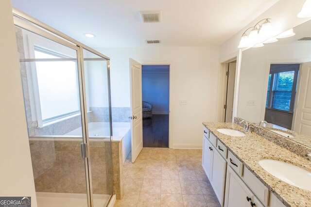 9872 Cameron Parc Cir, Johns Creek, GA 30022 - full bath with a stall shower, baseboards, double vanity, ensuite bath, and tile patterned flooring