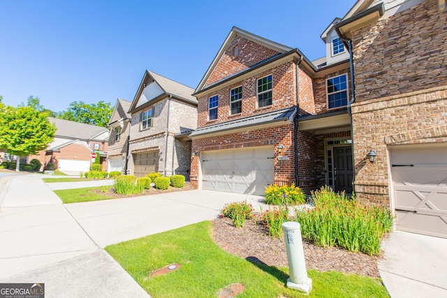 9872 Cameron Parc Cir, Johns Creek, GA 30022 - view of front facade with brick siding, an attached garage, and driveway