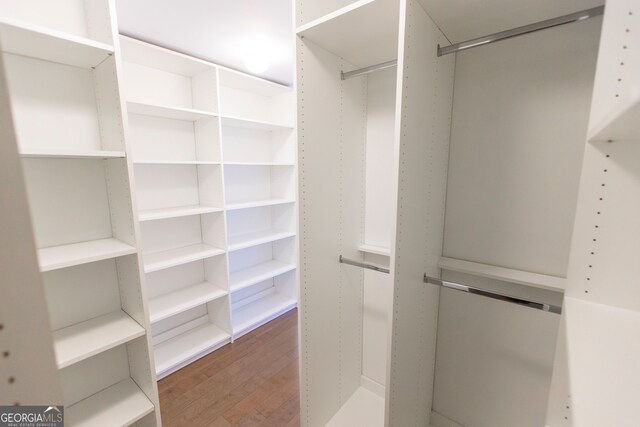 9872 Cameron Parc Cir, Johns Creek, GA 30022 - spacious closet featuring wood finished floors