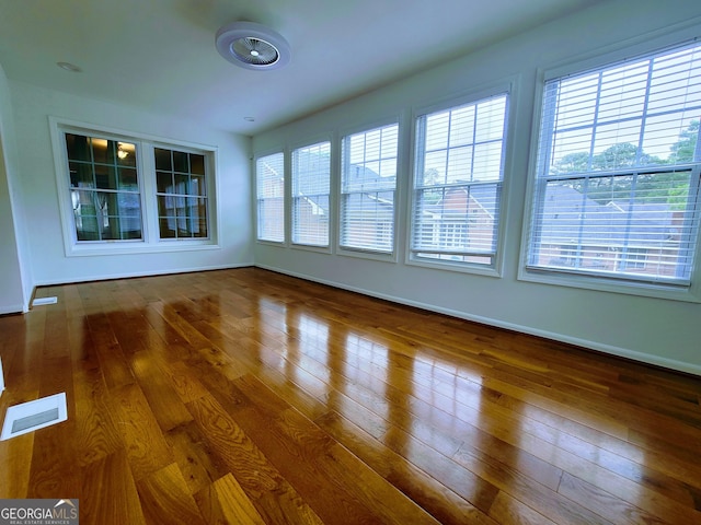 unfurnished sunroom featuring plenty of natural light