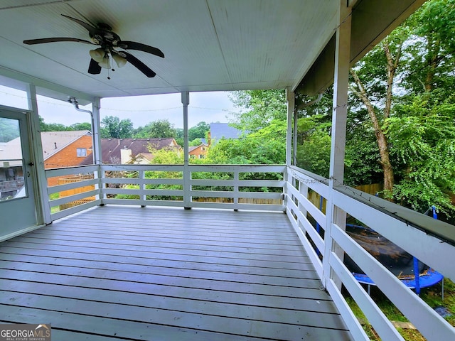 wooden deck featuring ceiling fan