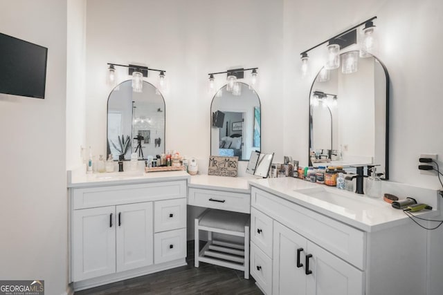 full bath featuring vanity, ensuite bath, a shower, and wood finished floors