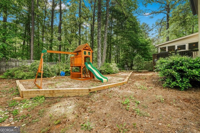 view of jungle gym with fence