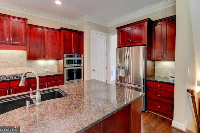 7520 Ledgewood Way, Suwanee, GA 30024 - kitchen featuring dark brown cabinets, stainless steel appliances, a sink, dark wood finished floors, and tasteful backsplash