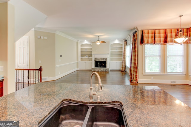 7520 Ledgewood Way, Suwanee, GA 30024 - kitchen with a sink, a ceiling fan, wood finished floors, built in shelves, and ornamental molding
