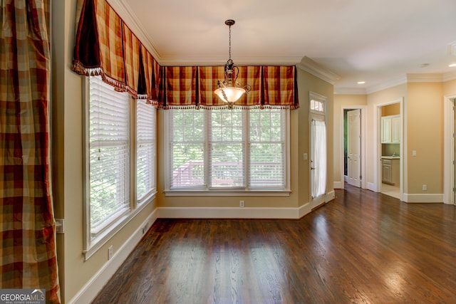 7520 Ledgewood Way, Suwanee, GA 30024 - unfurnished dining area with ornamental molding, plenty of natural light, dark wood finished floors, and baseboards