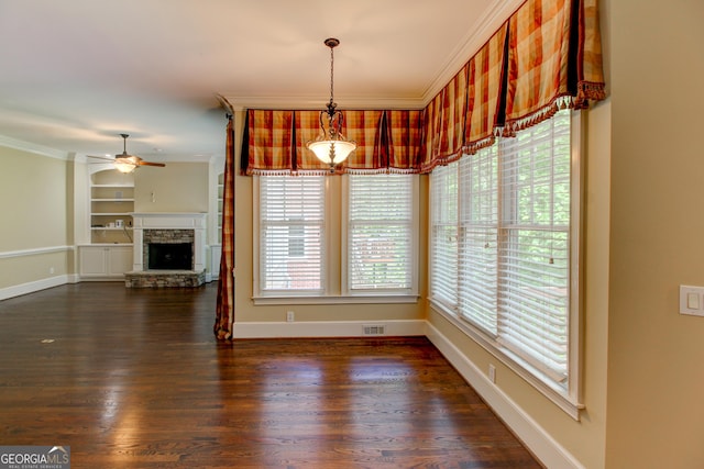7520 Ledgewood Way, Suwanee, GA 30024 - unfurnished dining area featuring crown molding, a ceiling fan, baseboards, built in shelves, and dark wood finished floors
