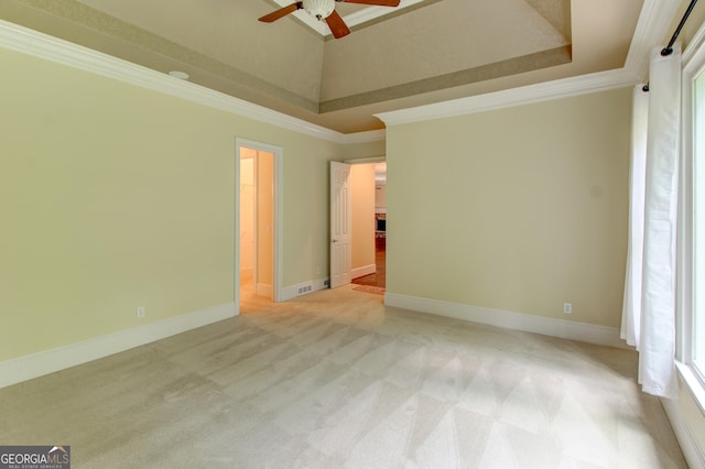 7520 Ledgewood Way, Suwanee, GA 30024 - empty room featuring light colored carpet, a raised ceiling, ornamental molding, and ceiling fan