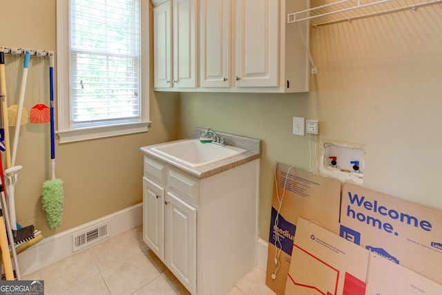 7520 Ledgewood Way, Suwanee, GA 30024 - laundry area featuring cabinet space, washer hookup, and light tile patterned floors