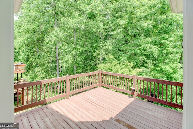 7520 Ledgewood Way, Suwanee, GA 30024 - wooden terrace with a forest view