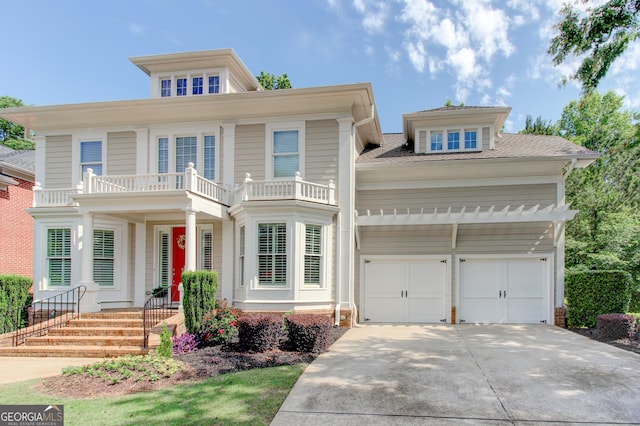 7520 Ledgewood Way, Suwanee, GA 30024 - view of front facade featuring a balcony, driveway, and an attached garage