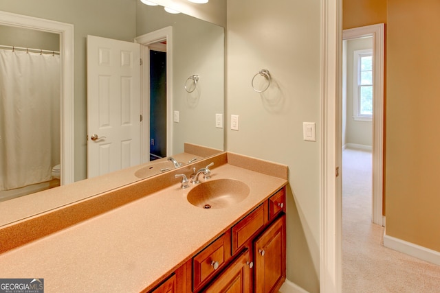 7520 Ledgewood Way, Suwanee, GA 30024 - bathroom with vanity and curtained shower